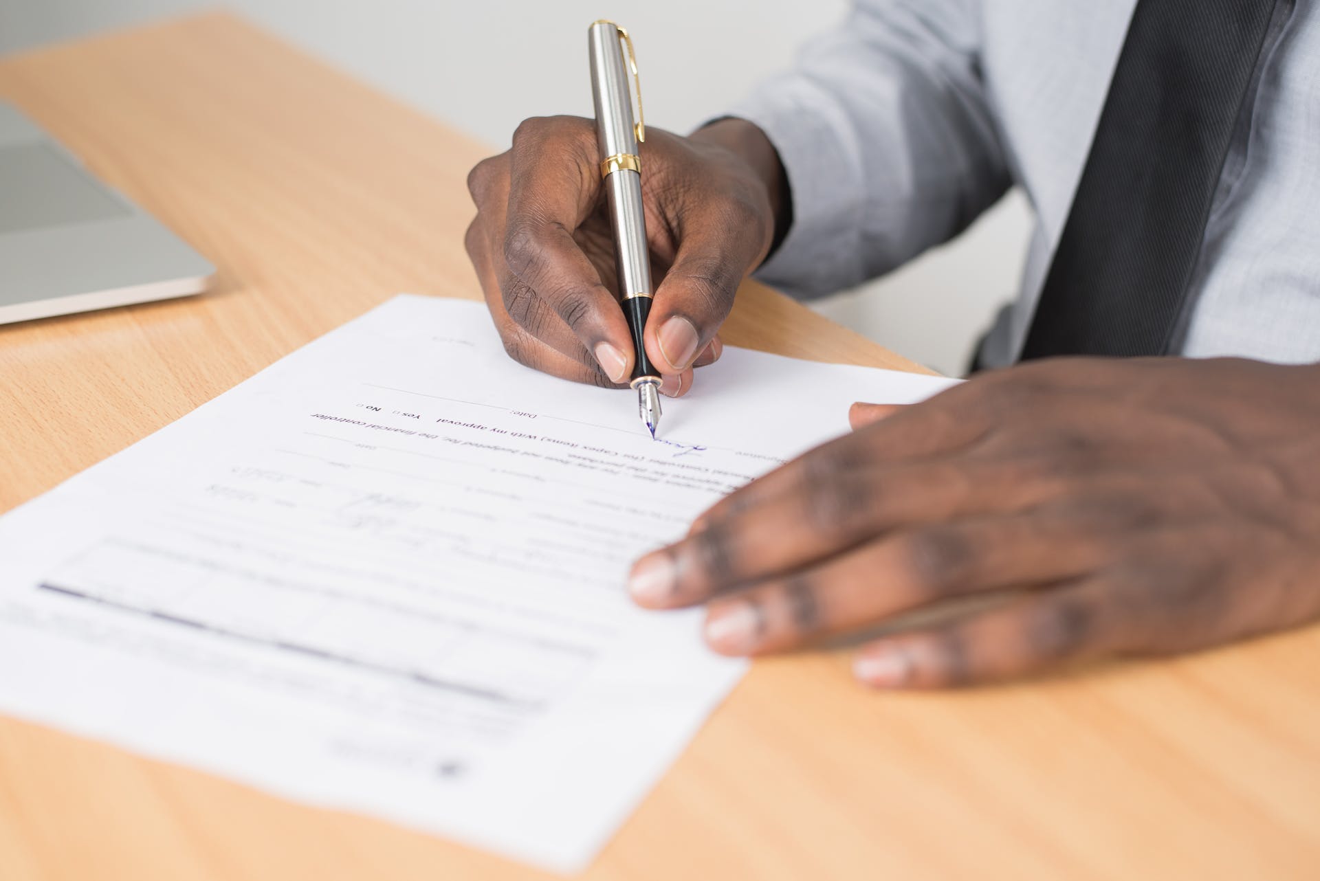 a user filling up his printed employment contract for his employer